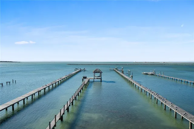 a room with furniture a air conditioner vent and a window