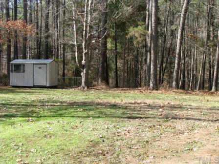 414 Tinkerbell Road Chapel Hill, NC 27517 - Photo 9 of 12 The large flat backyard is amazing - a rare find in Chapel Hill.