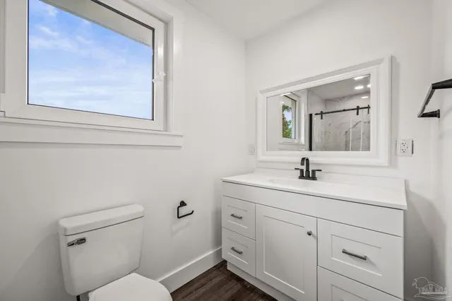 a bathroom with a sink vanity and mirror