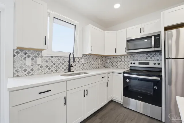 a bedroom with a bed and a chair