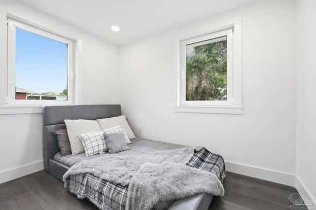 a bedroom with bed and window