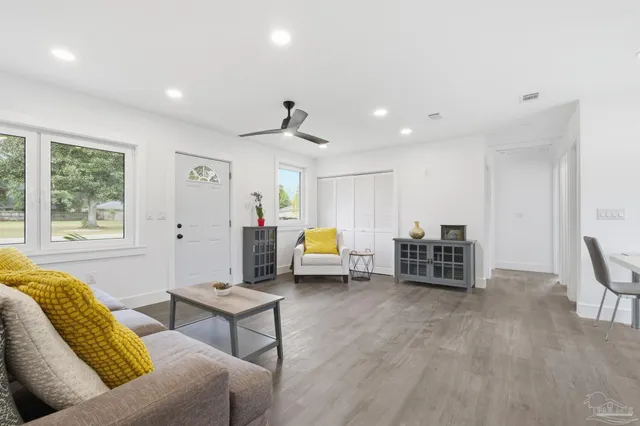 a living room with furniture and a table