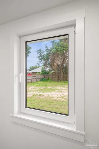 a view of a room that has a large window