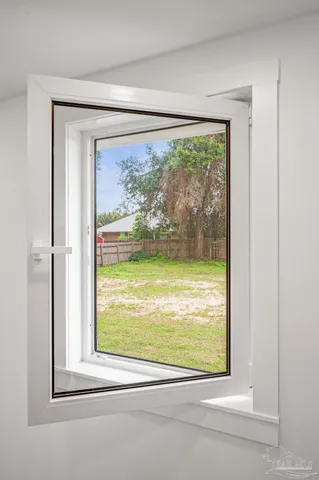a front view of house with yard and trees