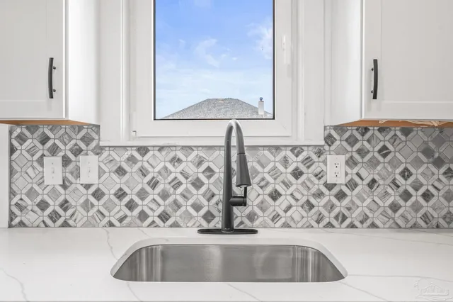 a view of a sink and a mirror