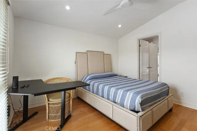 a bedroom with a bed and a table in it