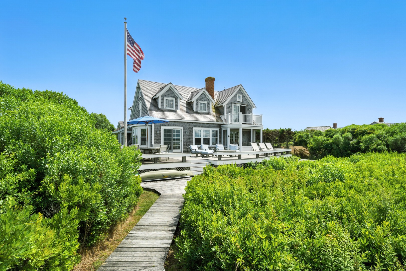 1 Little Neck Way, Unit 1 Nantucket, MA 02554 - Photo 18 of 99 a front view of a house with a yard