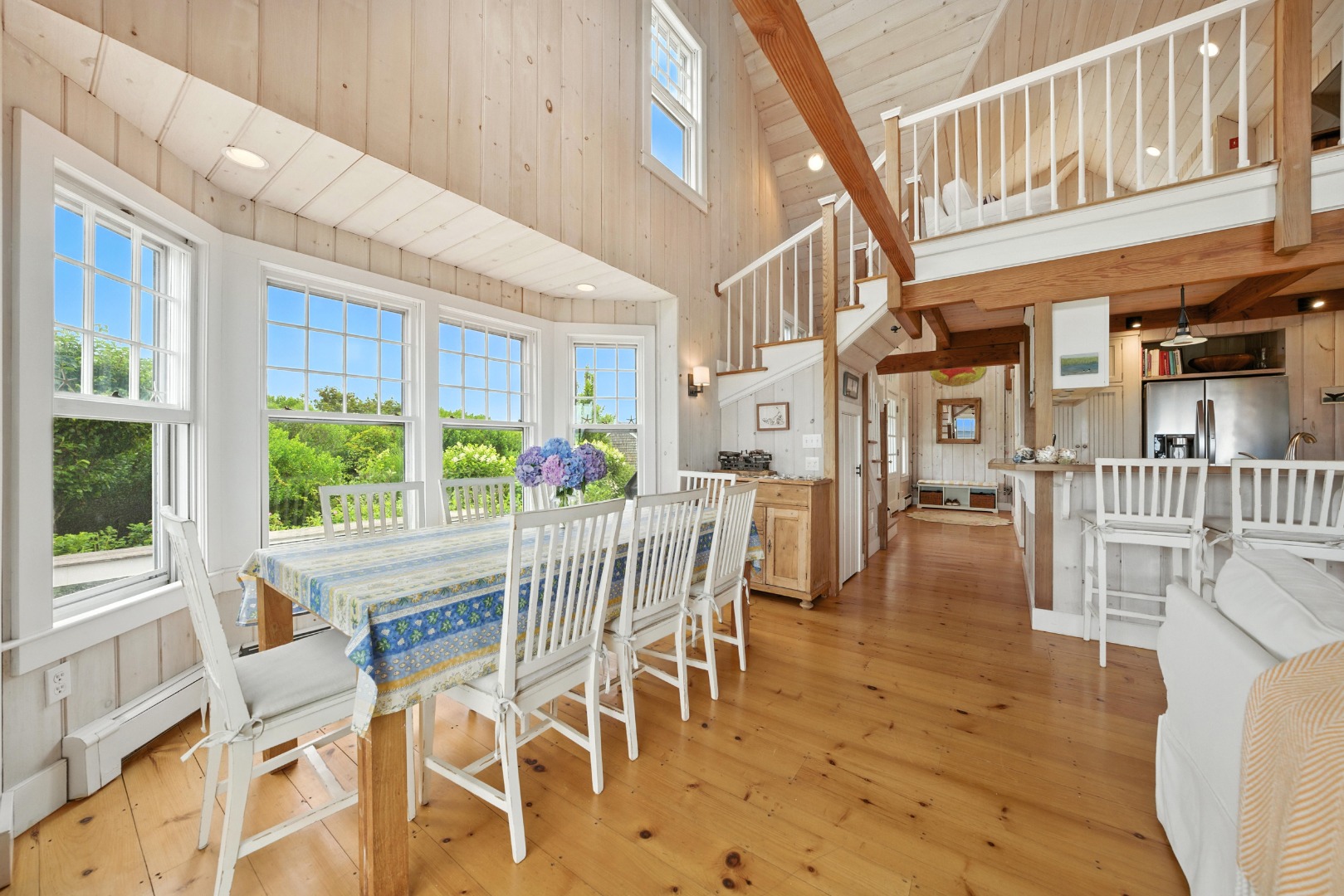 1 Little Neck Way, Unit 1 Nantucket, MA 02554 - Photo 41 of 99 a table and chairs in front of a building