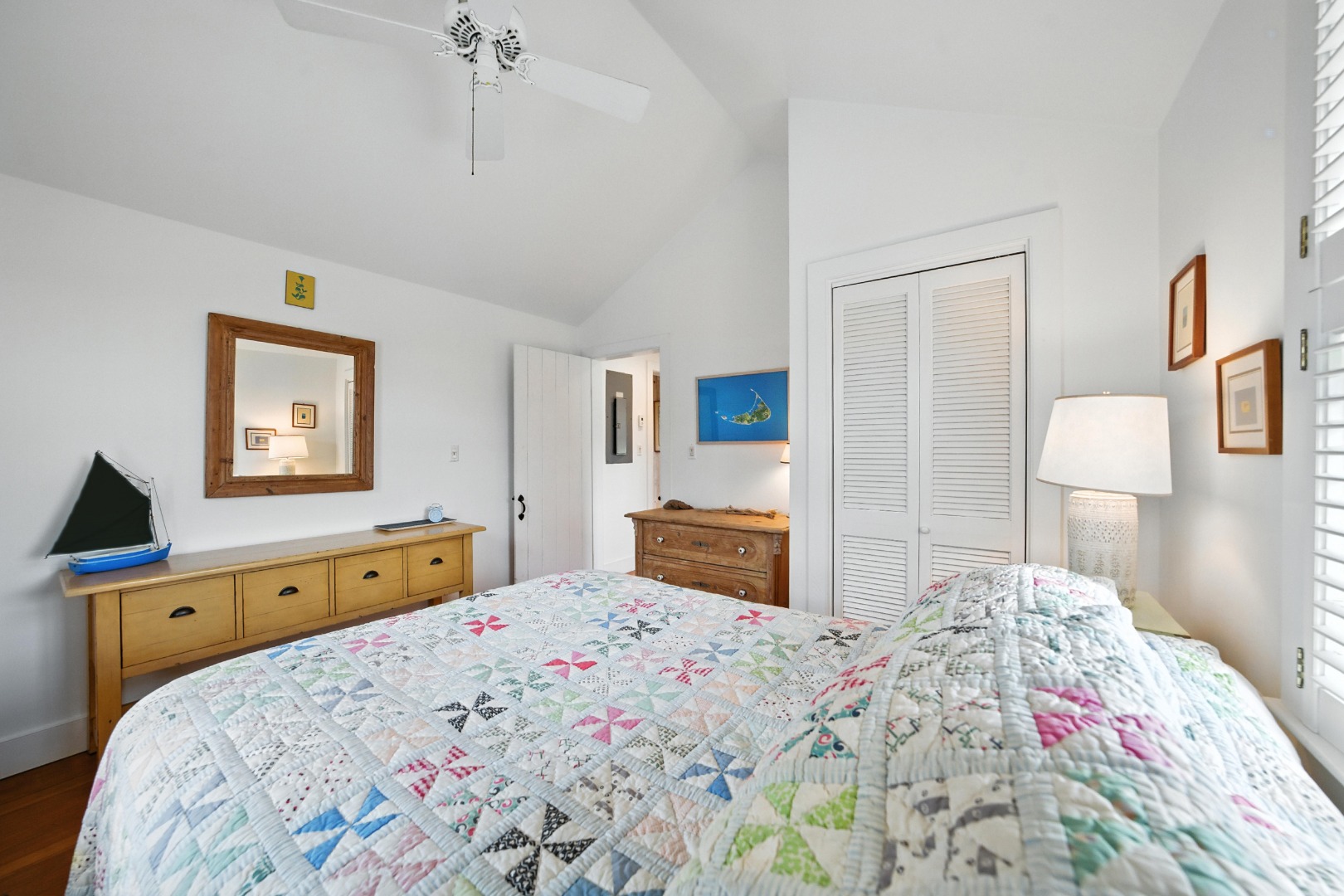 1 Little Neck Way, Unit 1 Nantucket, MA 02554 - Photo 58 of 99 a bedroom with a bed and a chandelier
