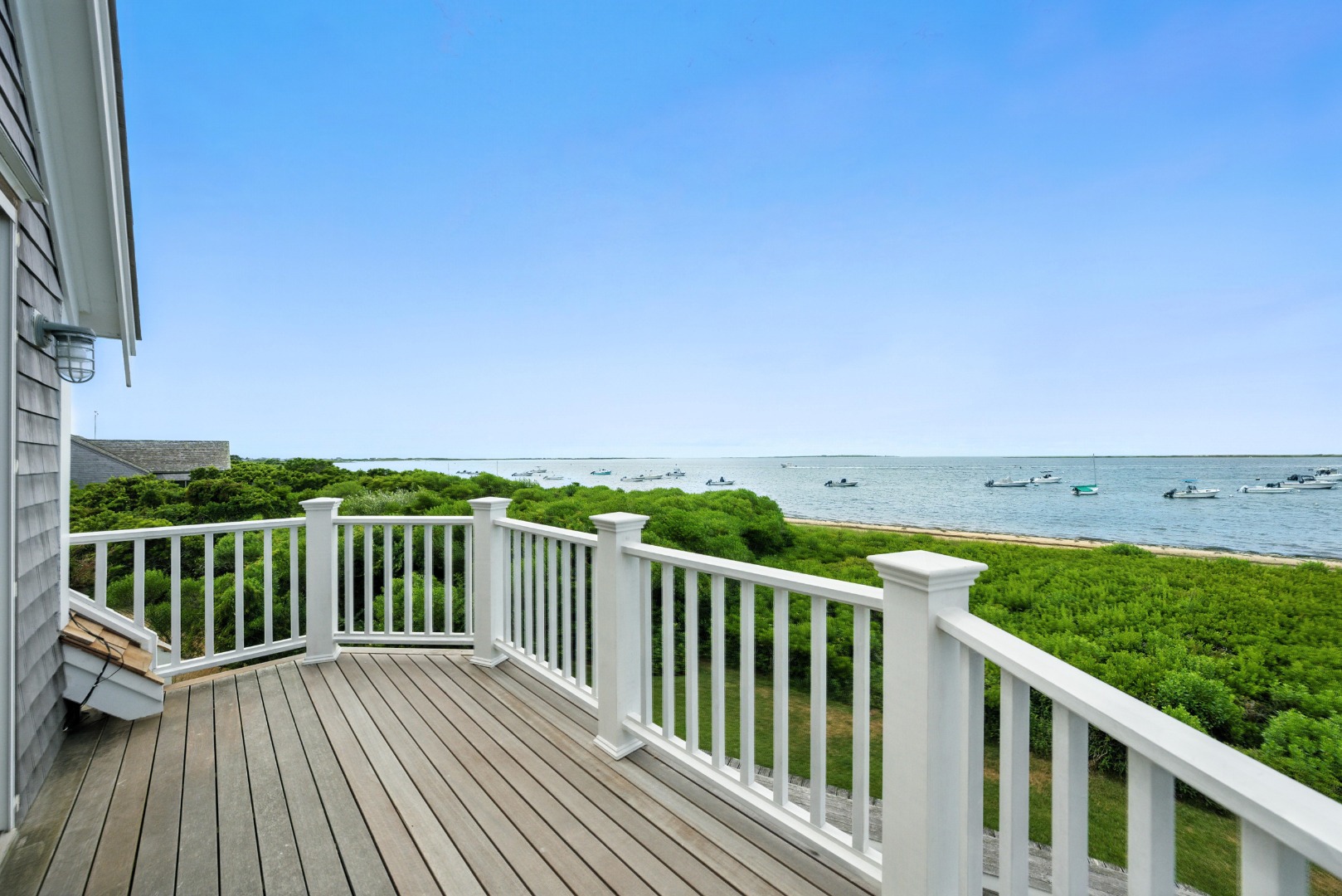 1 Little Neck Way, Unit 1 Nantucket, MA 02554 - Photo 80 of 99 a view of a balcony with wooden floor and fence