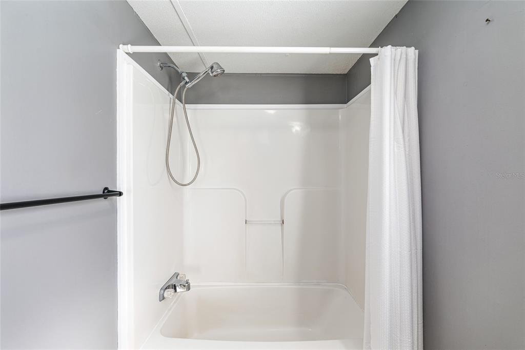 5600 Southeast 39th Street Trenton, FL 32693 - Photo 22 of 73 a bathroom with a glass shower door
