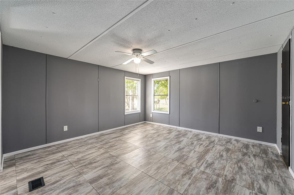 5600 Southeast 39th Street Trenton, FL 32693 - Photo 25 of 73 a view of empty room with window and ceiling fan