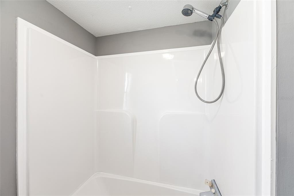 5600 Southeast 39th Street Trenton, FL 32693 - Photo 35 of 73 a bathroom with a shower and a window