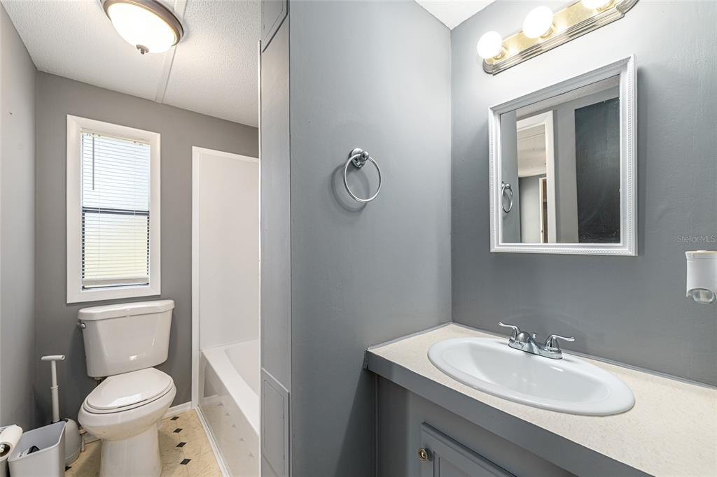 5600 Southeast 39th Street Trenton, FL 32693 - Photo 36 of 73 a bathroom with a sink toilet and vanity
