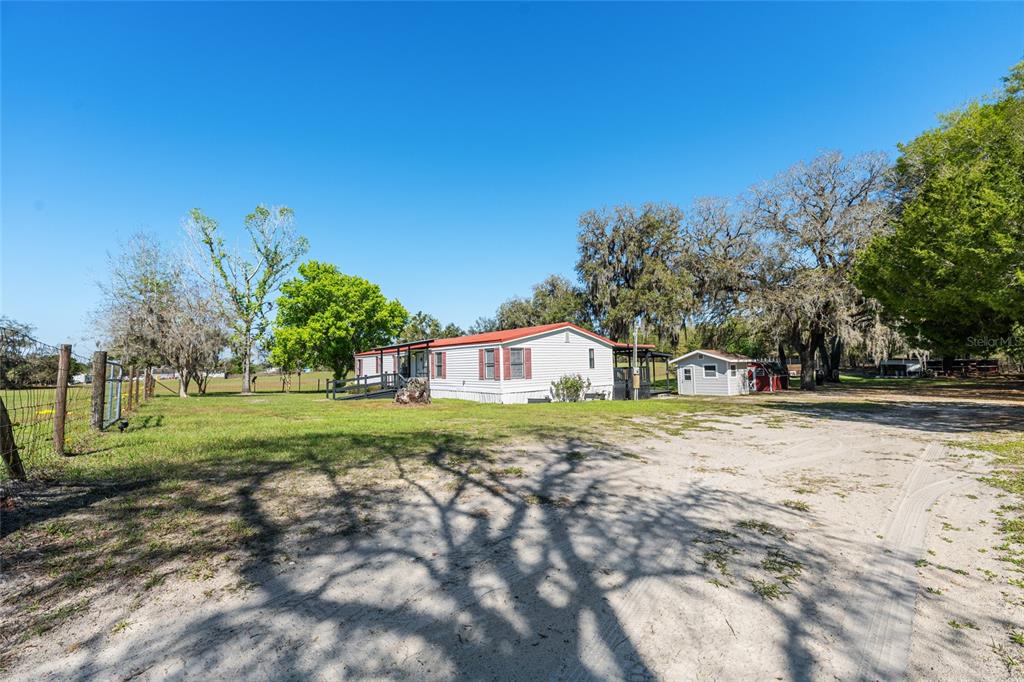 5600 Southeast 39th Street Trenton, FL 32693 - Photo 39 of 73 a front view of a house with a yard