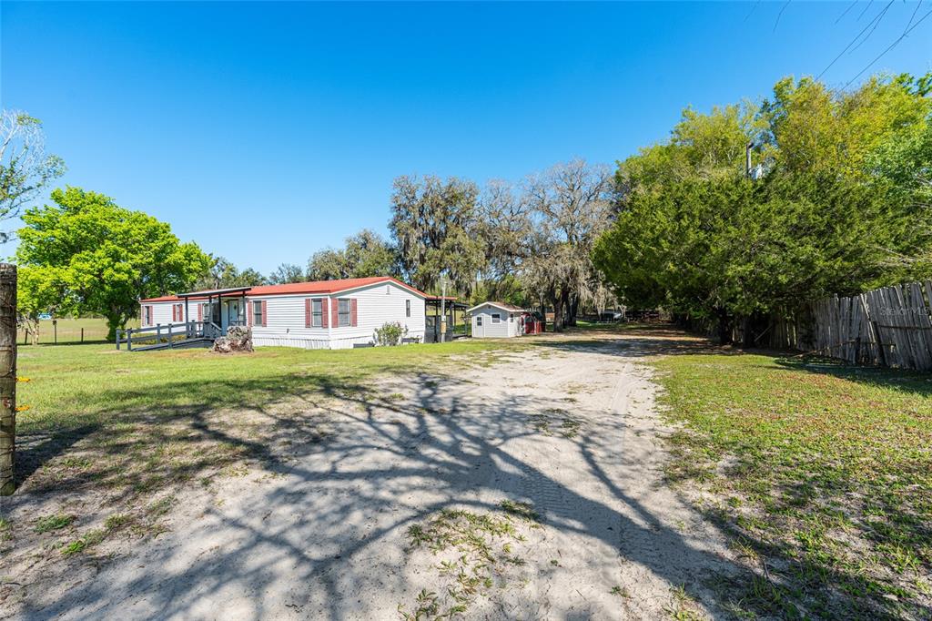 5600 Southeast 39th Street Trenton, FL 32693 - Photo 40 of 73 a view of yard with swimming pool and green space