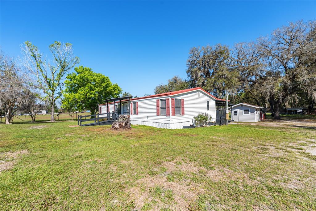 5600 Southeast 39th Street Trenton, FL 32693 - Photo 41 of 73 a front view of a house with a yard
