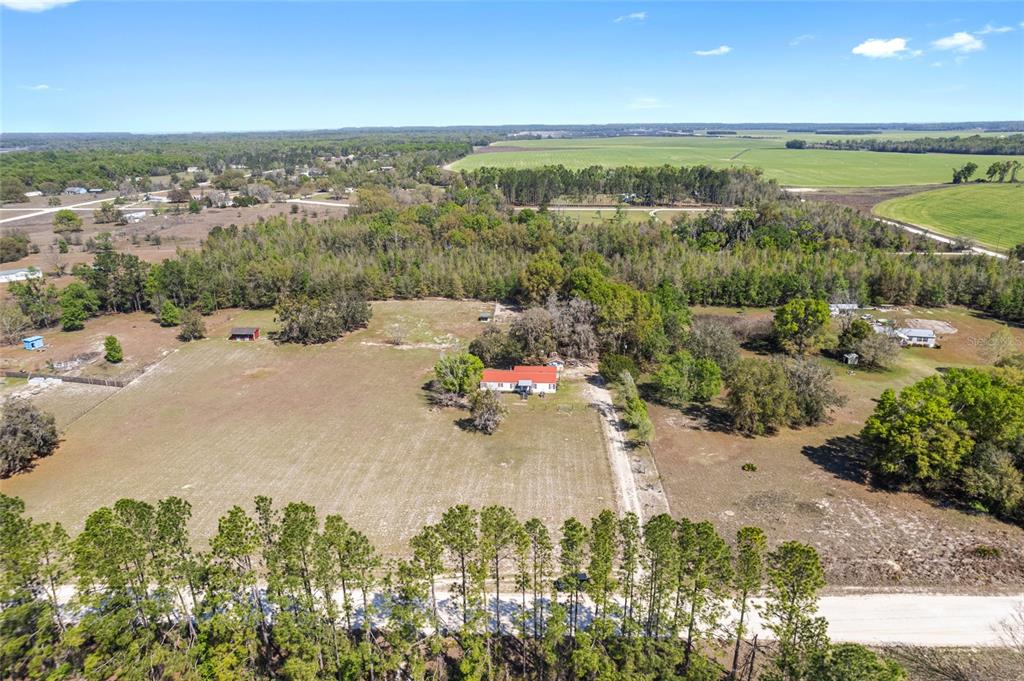 5600 Southeast 39th Street Trenton, FL 32693 - Photo 49 of 73 an aerial view of a houses with a yard and lake view