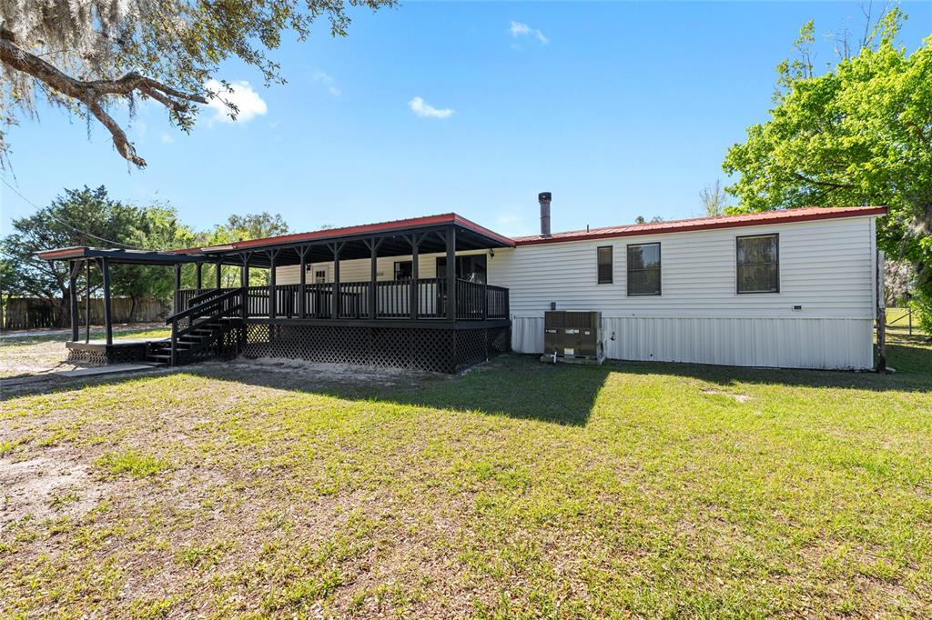 5600 Southeast 39th Street Trenton, FL 32693 - Photo 51 of 73 a view of a house with swimming pool and sitting area