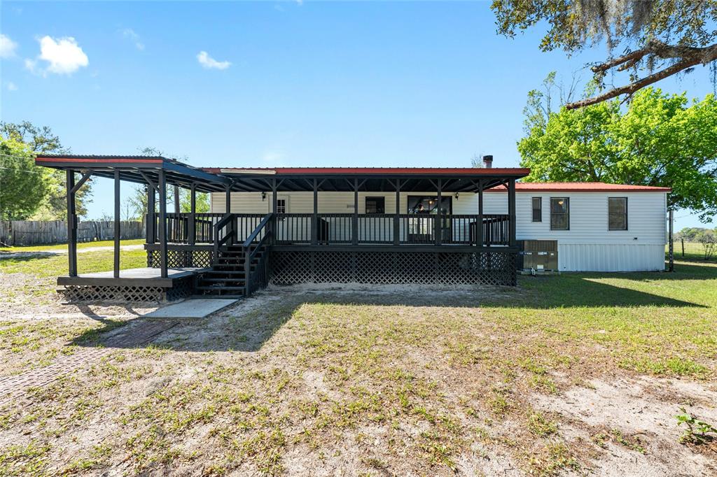 5600 Southeast 39th Street Trenton, FL 32693 - Photo 52 of 73 a view of a house with a swimming pool