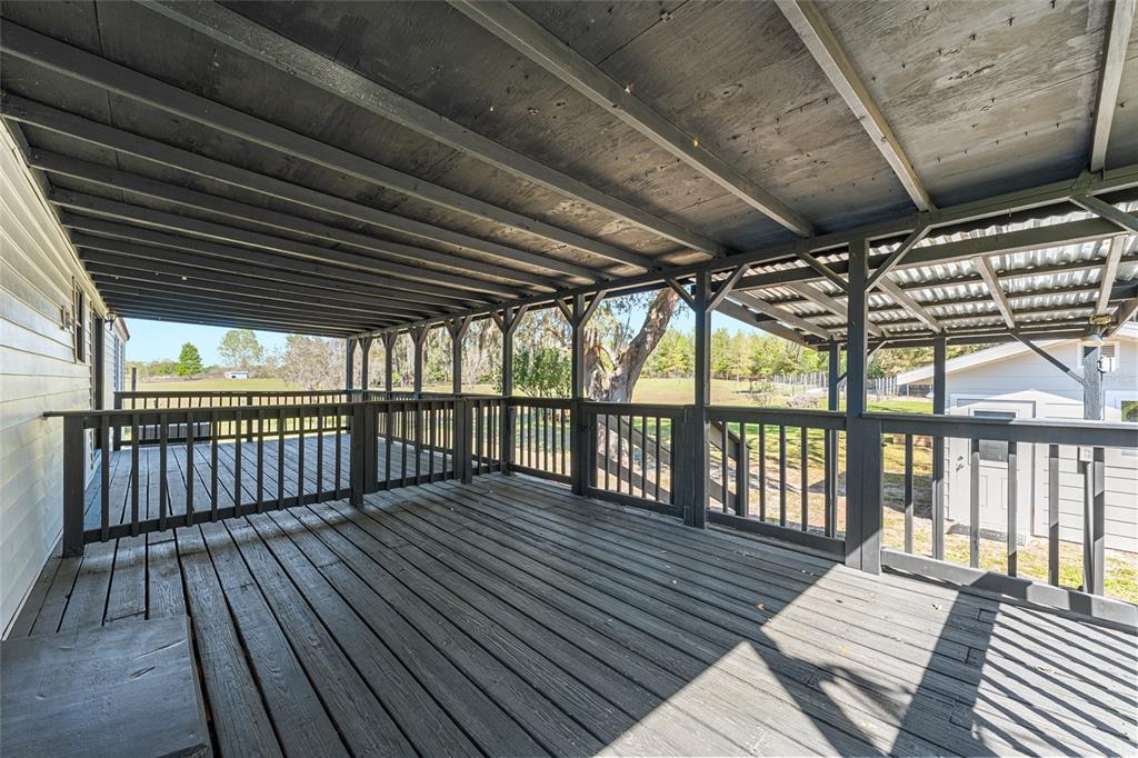5600 Southeast 39th Street Trenton, FL 32693 - Photo 55 of 73 a view of balcony with wooden floor