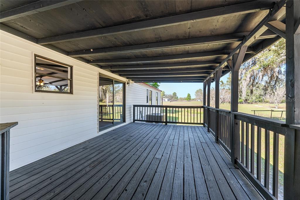 5600 Southeast 39th Street Trenton, FL 32693 - Photo 56 of 73 a view of deck with wooden floor