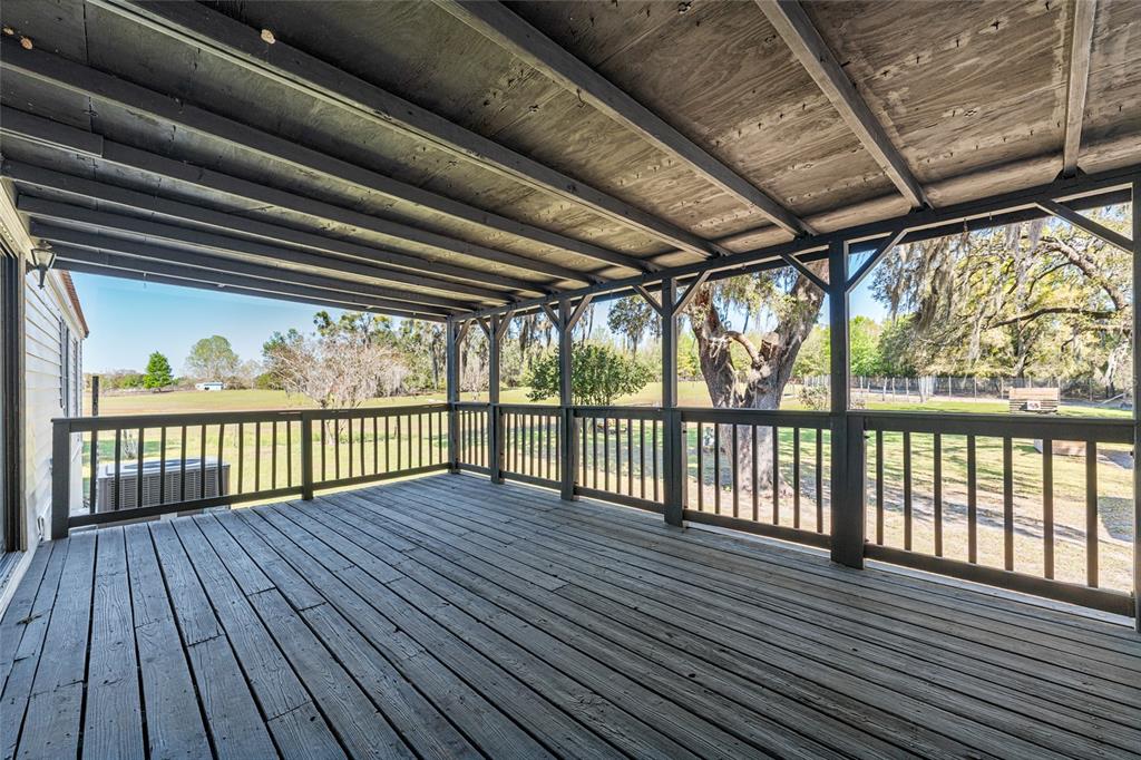 5600 Southeast 39th Street Trenton, FL 32693 - Photo 57 of 73 a view of porch with wooden floor