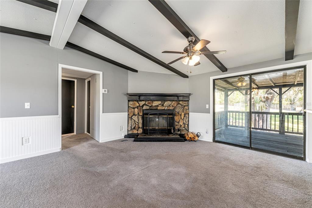 5600 Southeast 39th Street Trenton, FL 32693 - Photo 6 of 73 a view of an empty room with furniture and a fireplace