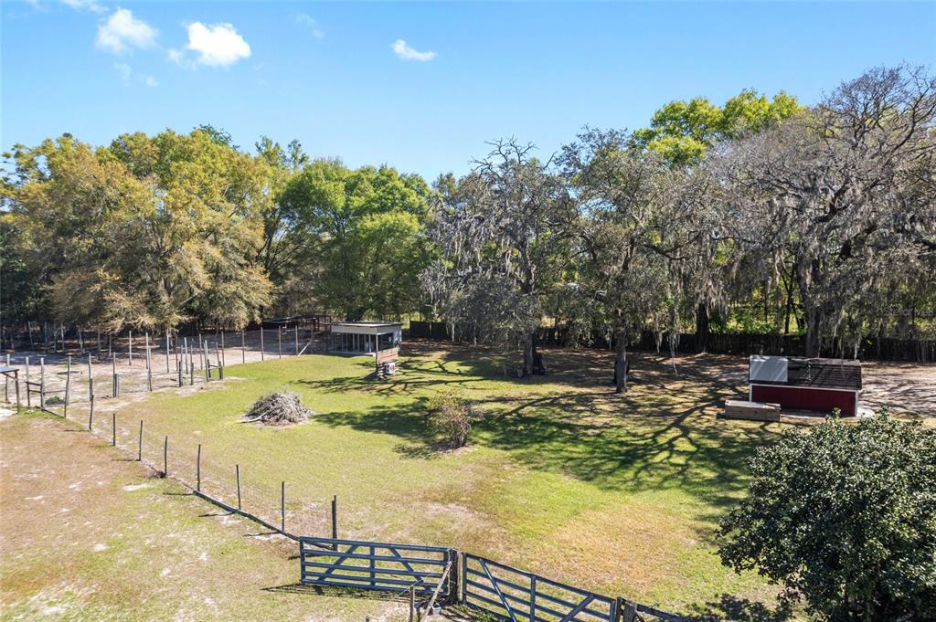 5600 Southeast 39th Street Trenton, FL 32693 - Photo 72 of 73 a view of a swimming pool with a patio and wooden fence