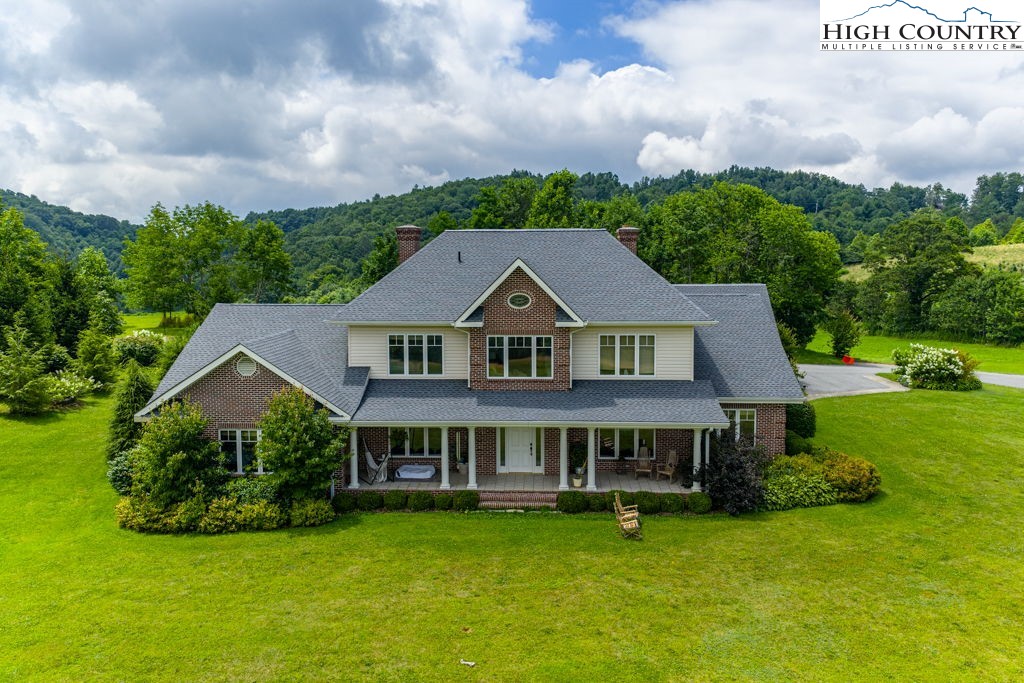 6985 Junaluska Road Boone, NC 28607 - Photo 1 of 49 a aerial view of a house with swimming pool and green space