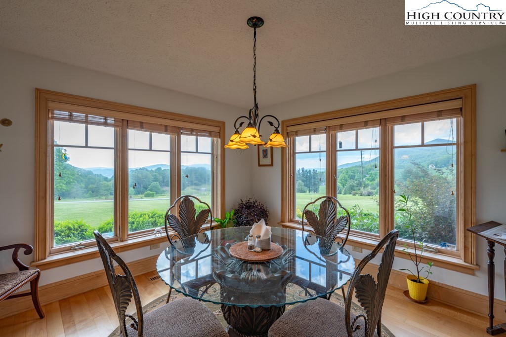 6985 Junaluska Road Boone, NC 28607 - Photo 11 of 49 a dining room with furniture mountain view and balcony view