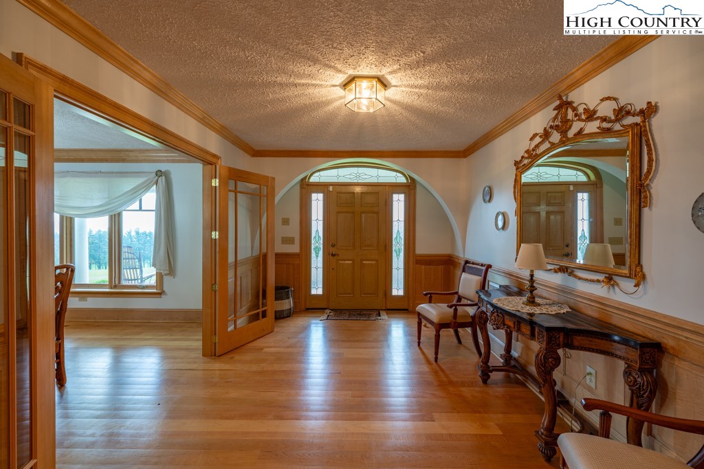 6985 Junaluska Road Boone, NC 28607 - Photo 14 of 49 a view of a livingroom with furniture window and wooden floor