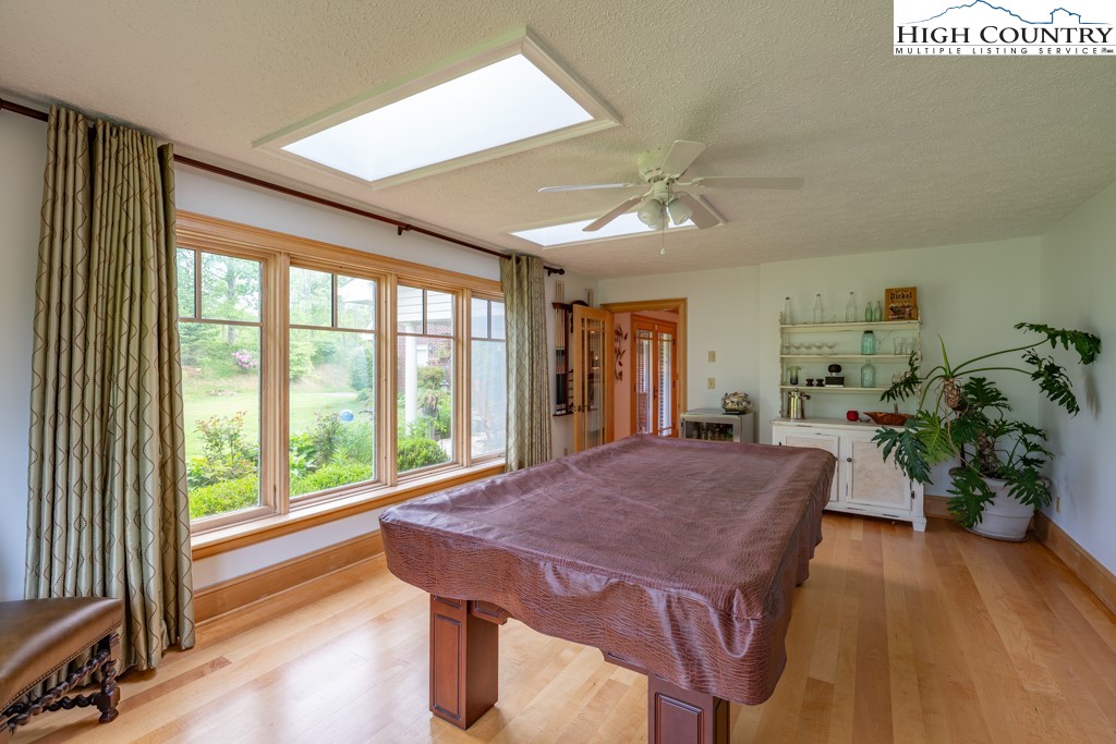6985 Junaluska Road Boone, NC 28607 - Photo 16 of 49 a view of a dining room with furniture window and wooden floor