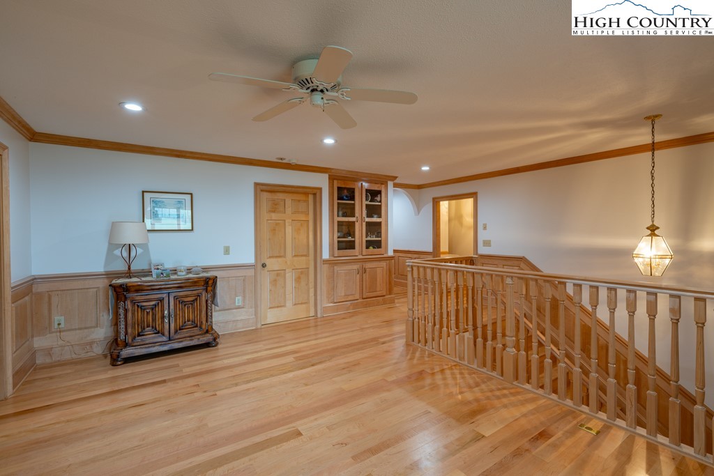6985 Junaluska Road Boone, NC 28607 - Photo 21 of 49 a view of an empty room with wooden floor and a window
