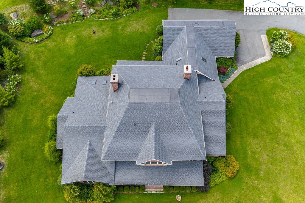 6985 Junaluska Road Boone, NC 28607 - Photo 3 of 49 an aerial view of a house with a yard basket ball court and outdoor seating