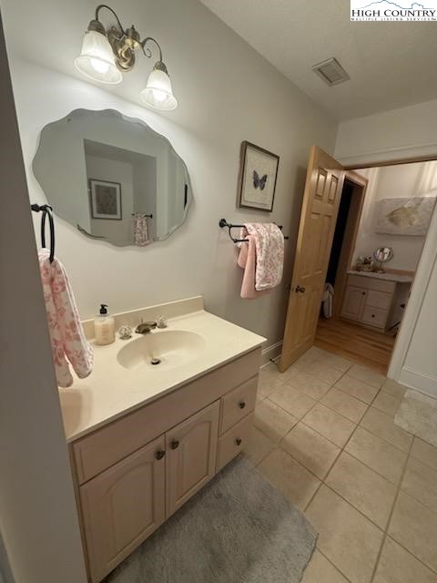 6985 Junaluska Road Boone, NC 28607 - Photo 31 of 49 a bathroom with a sink and mirror