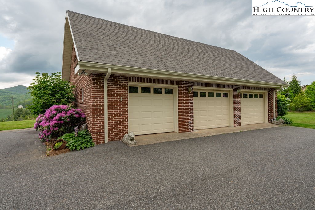 6985 Junaluska Road Boone, NC 28607 - Photo 34 of 49 a front view of a house with a garage