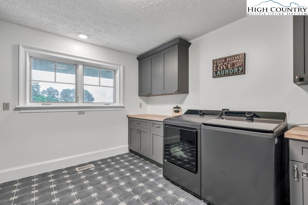 6985 Junaluska Road Boone, NC 28607 - Photo 44 of 49 a kitchen with a stove and a sink