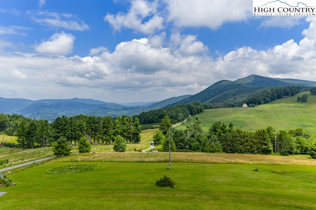 6985 Junaluska Road Boone, NC 28607 - Photo 47 of 49 a view of a golf course with a big yard