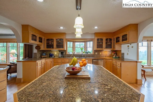 a view of a lobby with furniture and chandelier