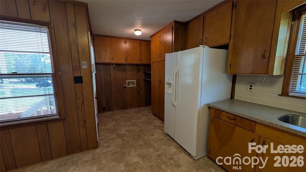 534 Westside Terrace Davidson, NC 28036 - Photo 9 of 18 a kitchen with refrigerator and window