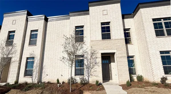 a front view of a building with many windows