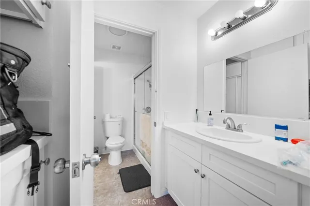 a bathroom with a sink a mirror and a shower