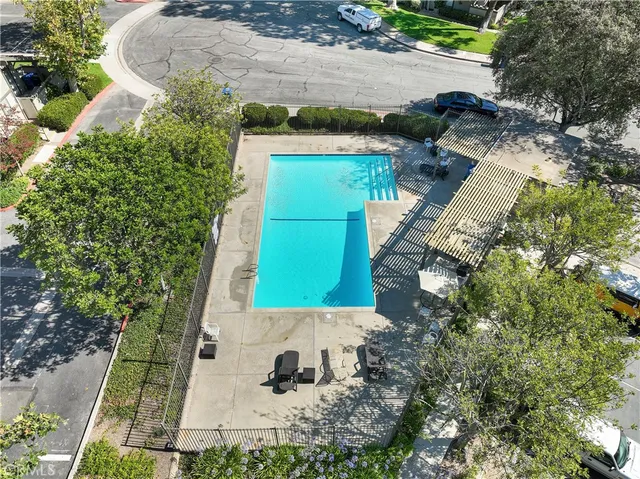 a view of house with outdoor space and swimming pool