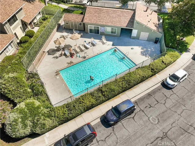 an aerial view of a residential houses with outdoor space