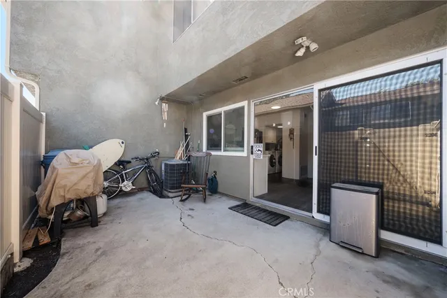a view of a livingroom with workspace and a couch