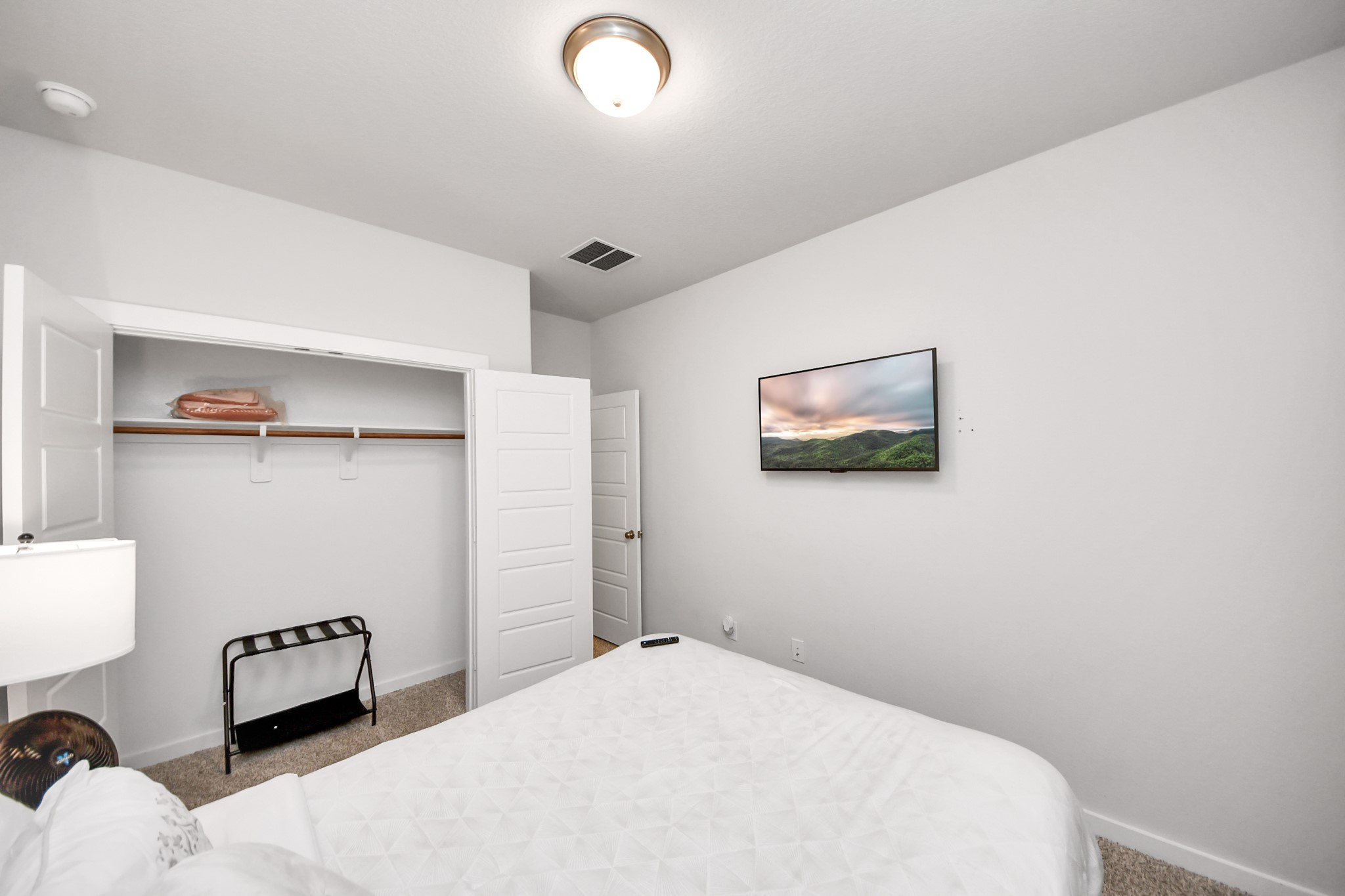 8207 Rising Stream Drive Houston, TX 77063 - Photo 28 of 50 a bedroom with a bed and a painting on the wall