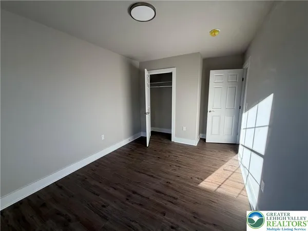 a view of a livingroom with wooden floor
