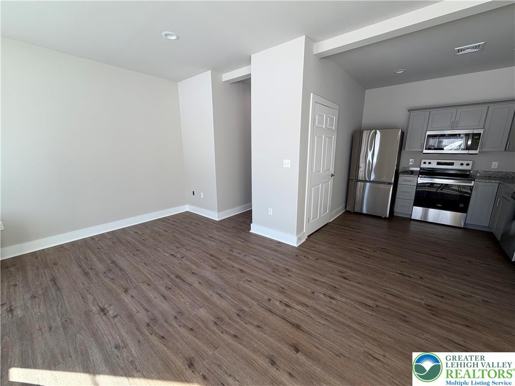 1747 Williams Street, Unit B Hellertown, PA 18055 - Photo 4 of 10 a view of kitchen with furniture and wooden floor