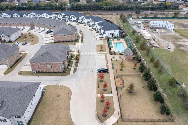 an aerial view of a house with swimming pool